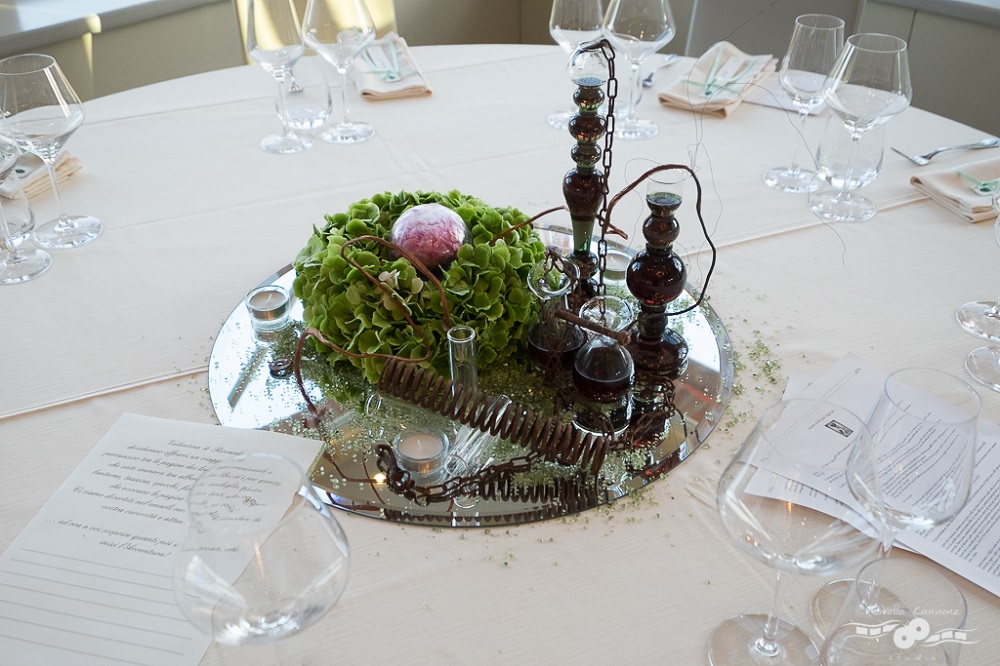 Frankenstein inspired centerpiece with test tubes and mysterious substances on a round mirror