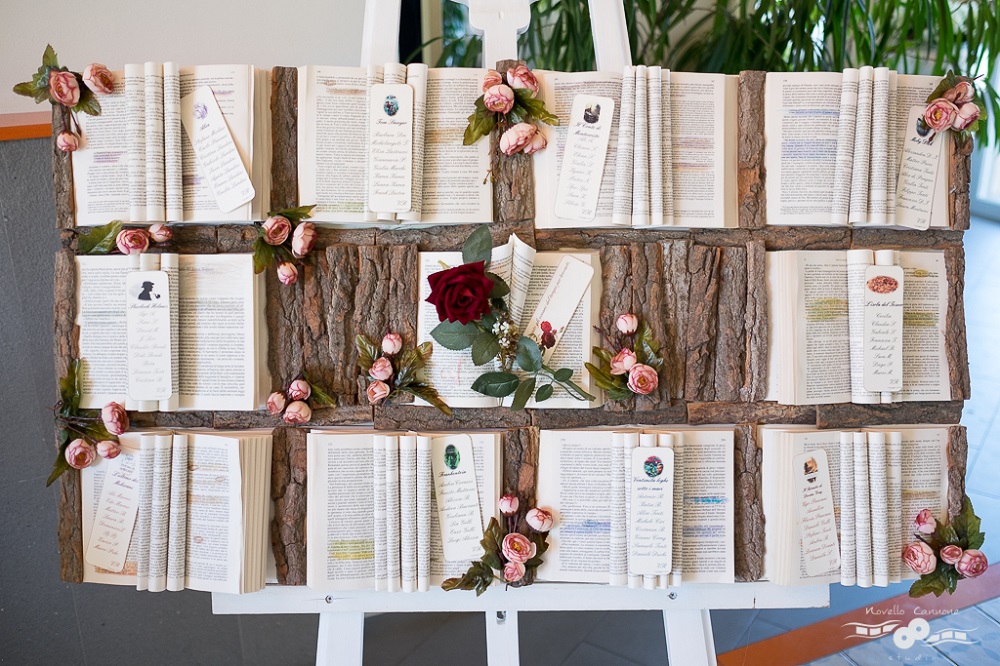 A tableau de mariage made with victorian literature on a piece of tree bark